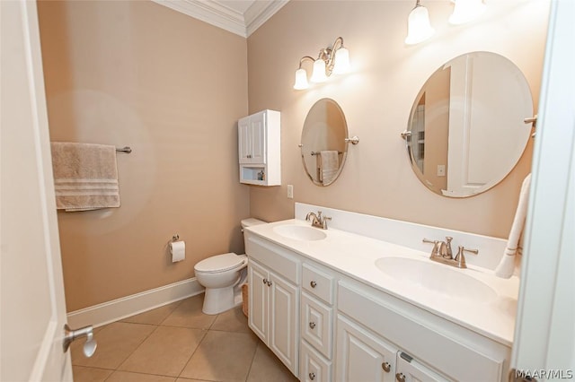 bathroom featuring vanity, crown molding, tile patterned floors, and toilet