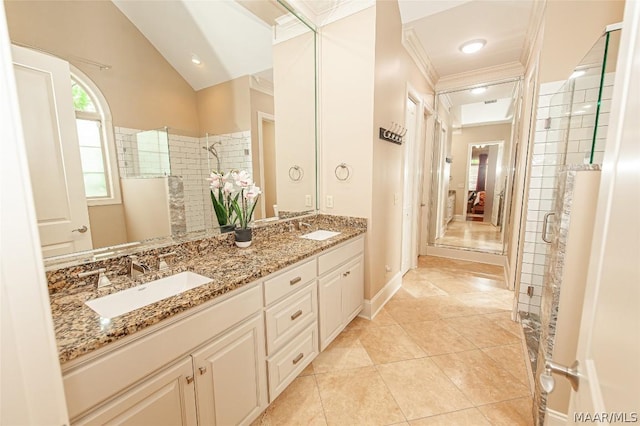 bathroom featuring lofted ceiling, vanity, ornamental molding, tile patterned floors, and walk in shower