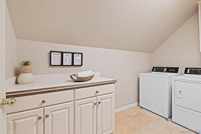 laundry area with cabinets and washing machine and dryer