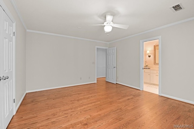 unfurnished bedroom featuring ensuite bath, ceiling fan, crown molding, and light hardwood / wood-style flooring