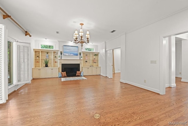 unfurnished living room featuring a notable chandelier, light wood-type flooring, and ornamental molding