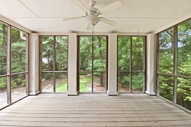 unfurnished sunroom featuring plenty of natural light and ceiling fan