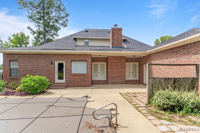 back of house with a patio area