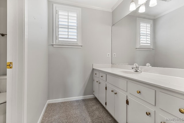 bathroom with crown molding, vanity, and toilet