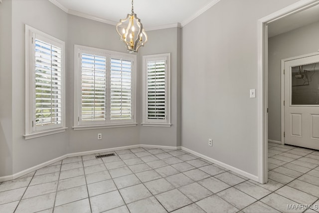 tiled spare room featuring ornamental molding and a chandelier