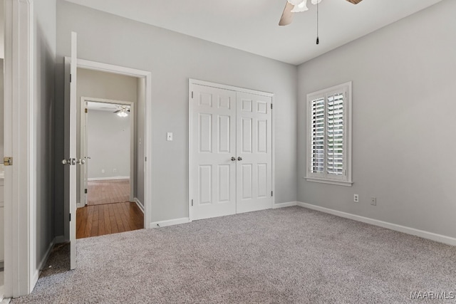 unfurnished bedroom featuring carpet flooring, ceiling fan, and a closet