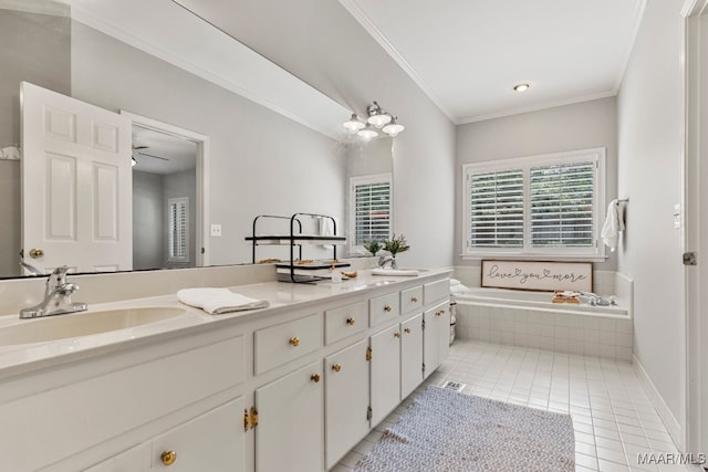 bathroom with vanity, tile patterned flooring, ceiling fan, ornamental molding, and tiled tub