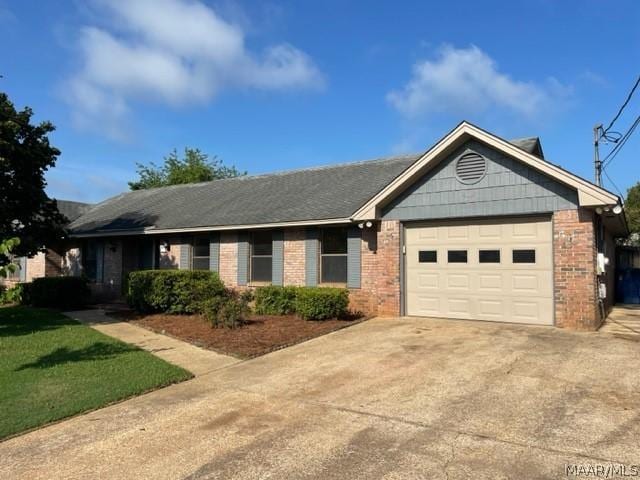 ranch-style home featuring a garage