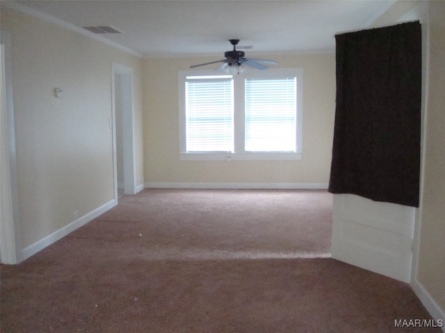 spare room featuring visible vents, ceiling fan, carpet, and baseboards