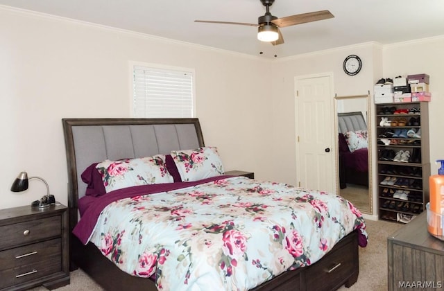 bedroom with light carpet, ceiling fan, and crown molding