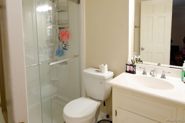 full bath with a stall shower, toilet, and vanity