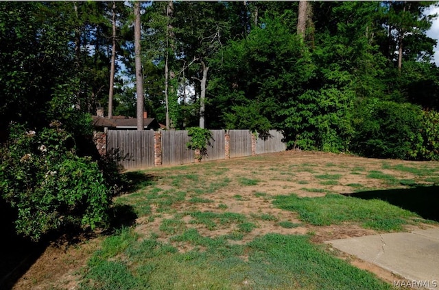 view of yard with fence