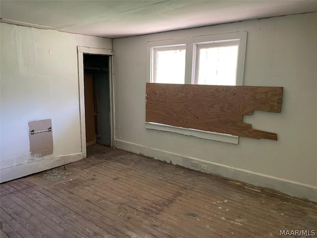 spare room with hardwood / wood-style flooring