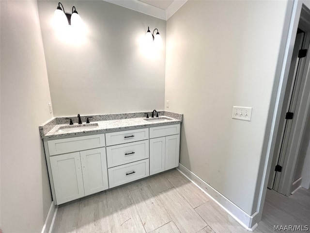 bathroom with wood-type flooring and vanity