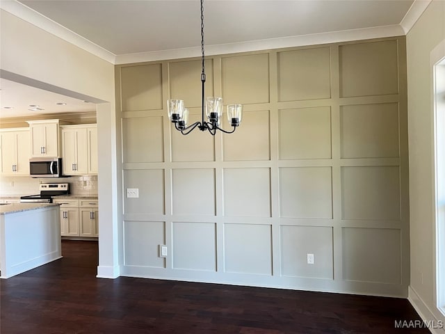 kitchen with light stone counters, tasteful backsplash, decorative light fixtures, dark wood-type flooring, and appliances with stainless steel finishes