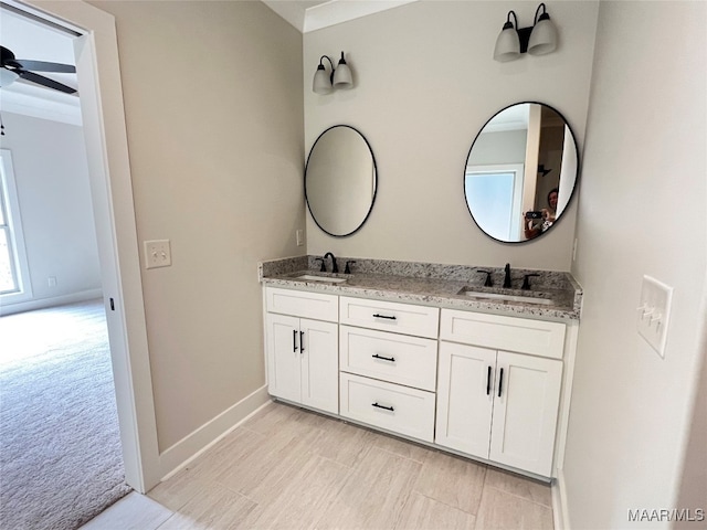 bathroom with ceiling fan and vanity