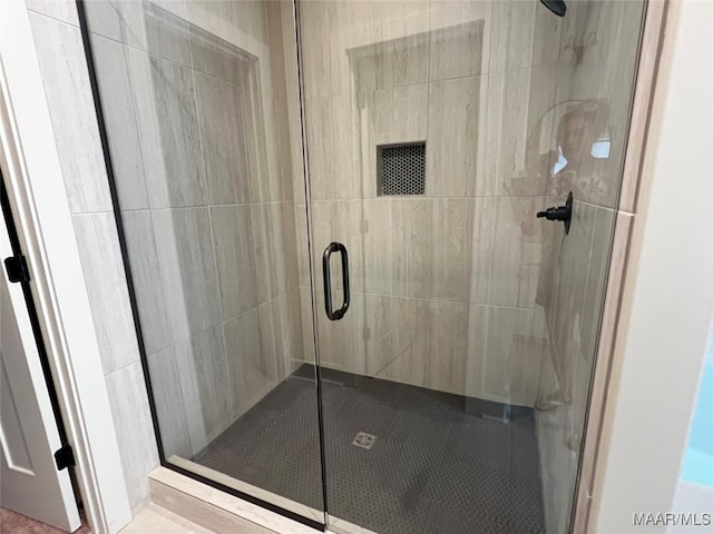 bathroom with an enclosed shower