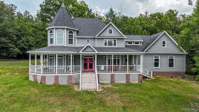 view of front of home featuring french doors, a front lawn, and covered porch