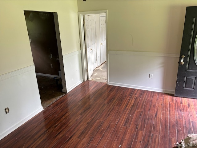 spare room featuring wood-type flooring