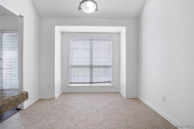 empty room featuring light tile patterned floors