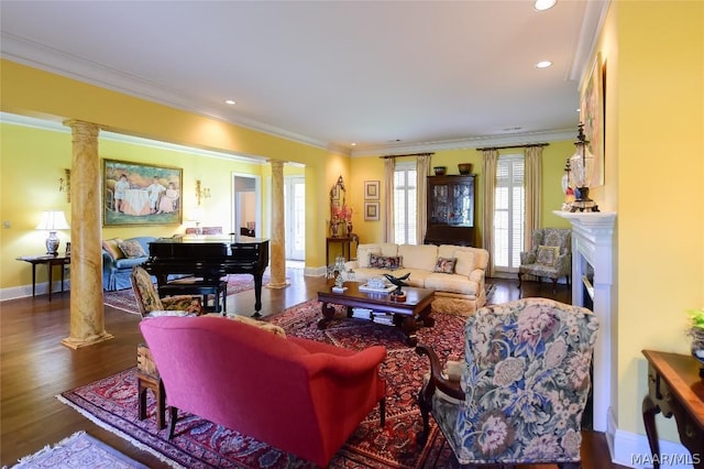 living room featuring dark hardwood / wood-style flooring, ornate columns, and ornamental molding