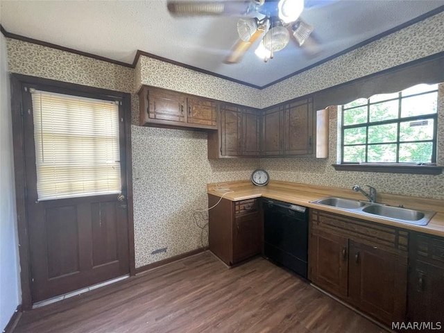 kitchen featuring wallpapered walls, dishwasher, ornamental molding, light countertops, and a sink