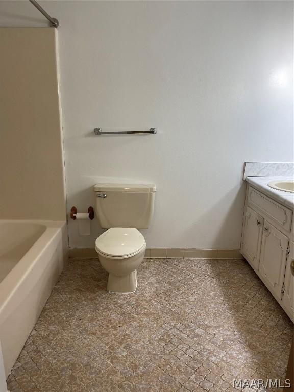 full bathroom featuring shower / bathing tub combination, tile patterned floors, toilet, and vanity