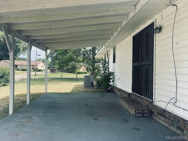 view of patio featuring an attached carport and cooling unit