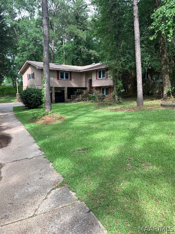 view of front of home with a front yard