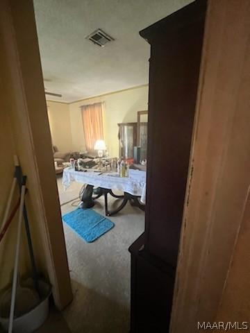 bedroom with visible vents and carpet