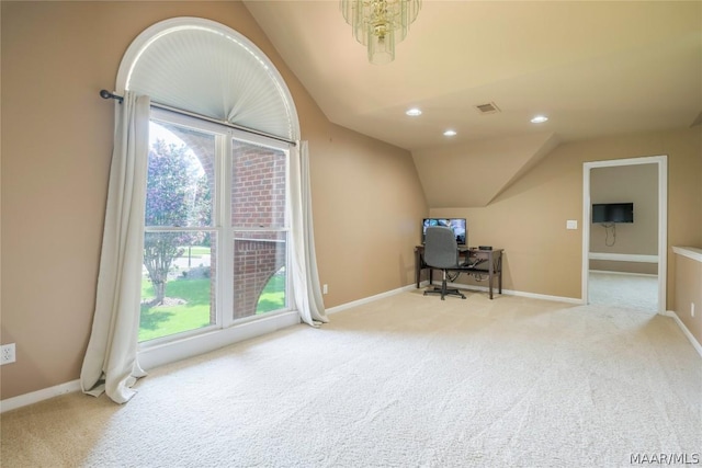 office space featuring carpet floors, baseboards, visible vents, and vaulted ceiling