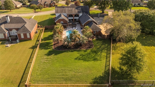 birds eye view of property with a residential view