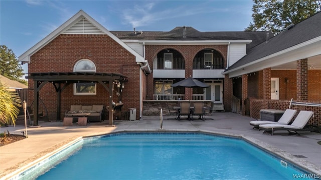 pool with a patio and outdoor lounge area