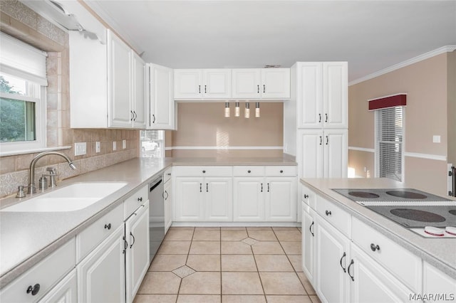 kitchen with black electric stovetop, light countertops, backsplash, light tile patterned flooring, and a sink