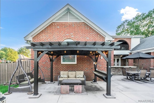 view of patio featuring fence, an outdoor living space, and a pergola