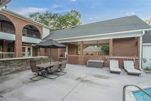 view of patio with ceiling fan, outdoor dining area, an outdoor living space, and a pool