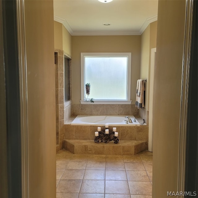 bathroom featuring tiled tub, ornamental molding, and tile patterned floors