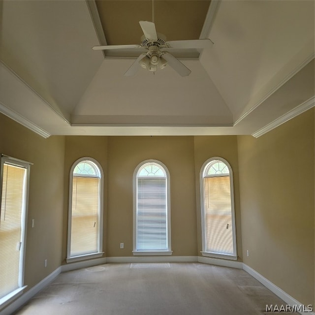 spare room featuring crown molding, ceiling fan, carpet flooring, and a healthy amount of sunlight