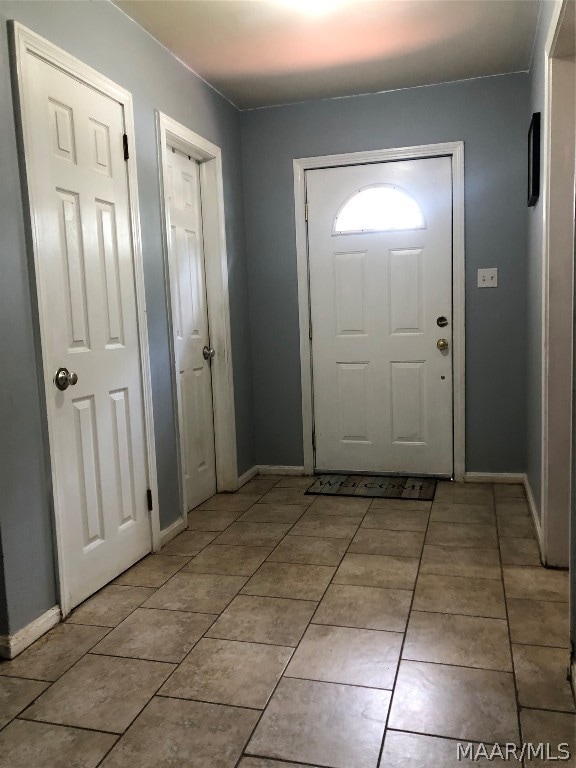 foyer with light tile patterned floors