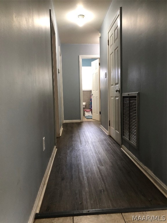 hallway featuring wood-type flooring