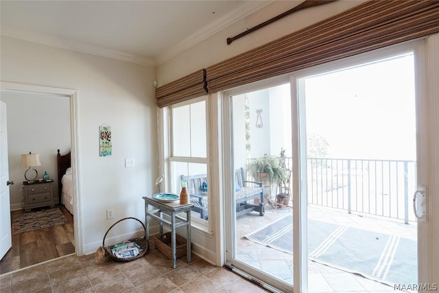 doorway to outside featuring ornamental molding