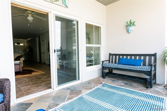 exterior space featuring ceiling fan and a patio area