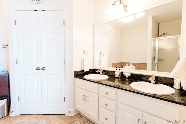 bathroom featuring vanity and walk in shower