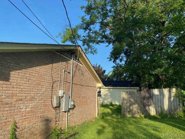 view of property exterior featuring a yard