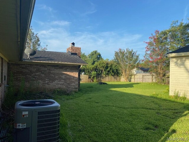 view of yard with central air condition unit