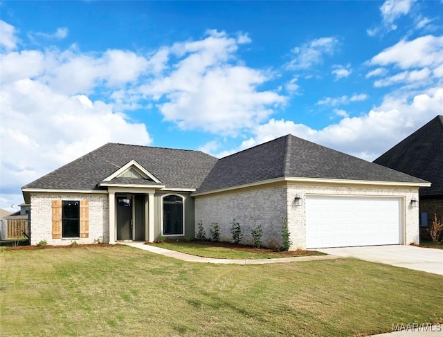 view of front of house featuring brick siding, a front yard, concrete driveway, and a garage