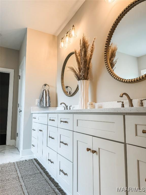 1379 Barret Park Way, Montgomery, AL 36117 - full bathroom with marble look tile flooring, double vanity, and baseboards