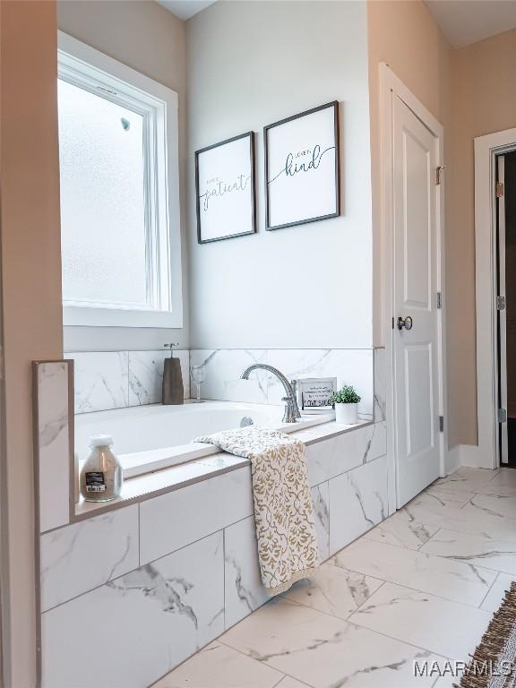 1379 Barret Park Way, Montgomery, AL 36117 - full bath with a garden tub and marble look tiles