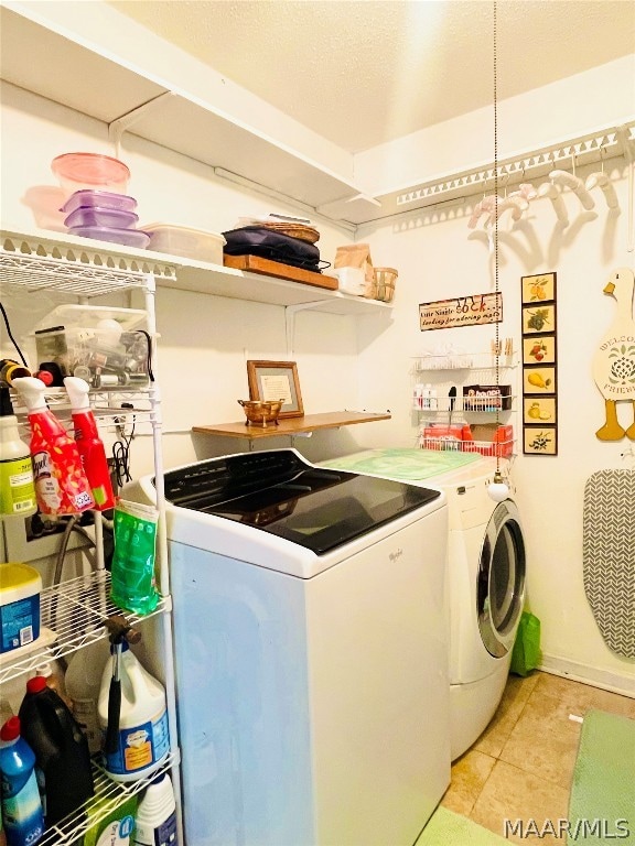 clothes washing area featuring independent washer and dryer