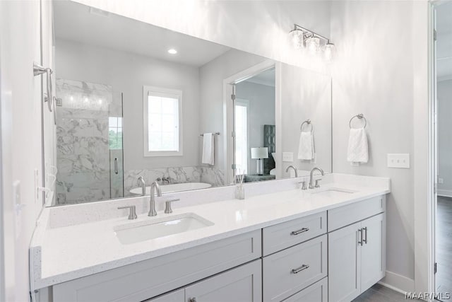 bathroom featuring vanity and a shower with shower door